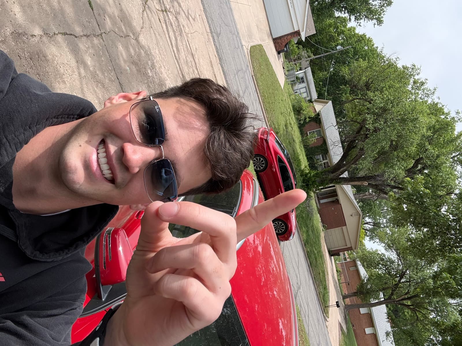 Brayden Myers, owner of We Buy Houses Columbia, standing in front of a recently purchased home in Columbia, Missouri