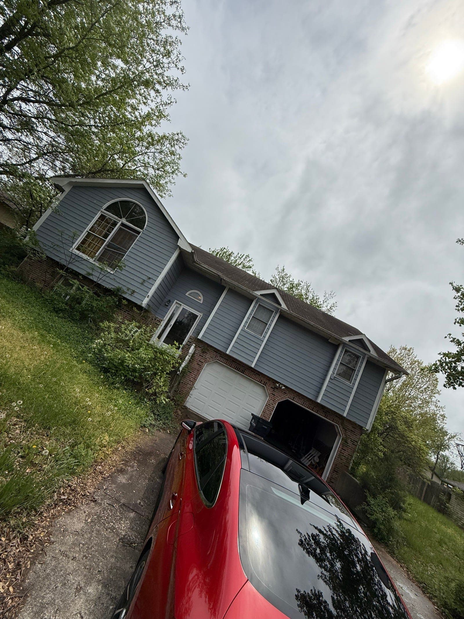 Blue-gray split-level house with an attached garage